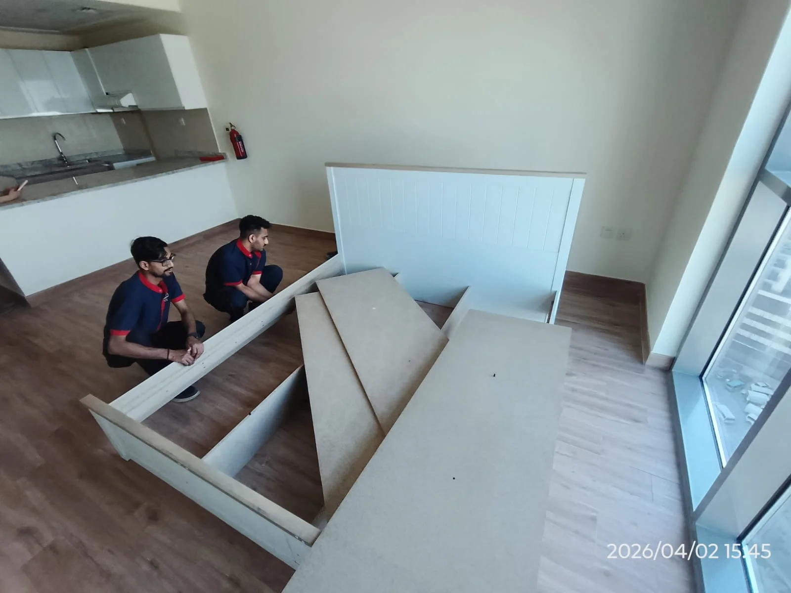 Technicians assembling a wardrobe inside a Dubai home — supporting project view 1