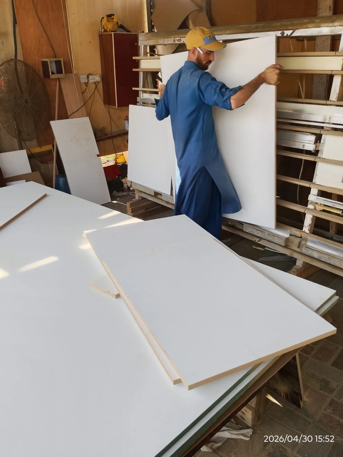 Carpenter working on wooden panels in a Dubai workshop