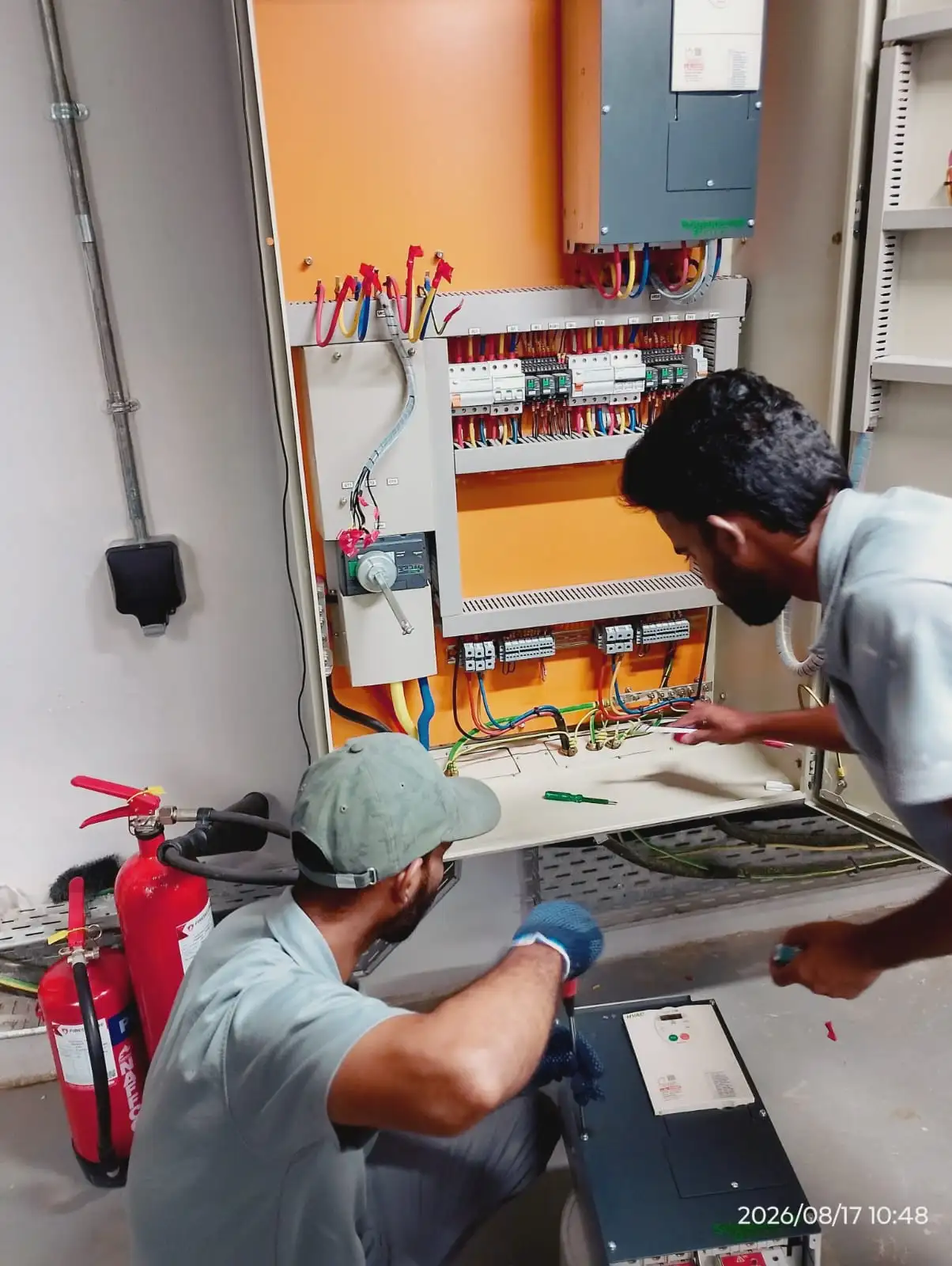 Technician working on an electrical panel in Dubai
