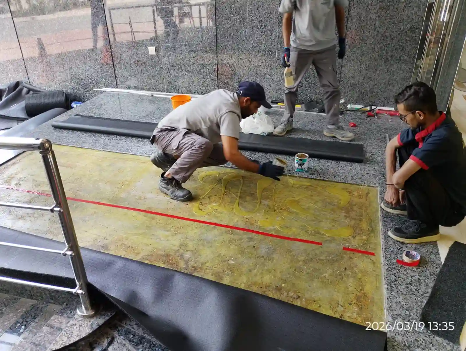 Technicians installing flooring at a Dubai property