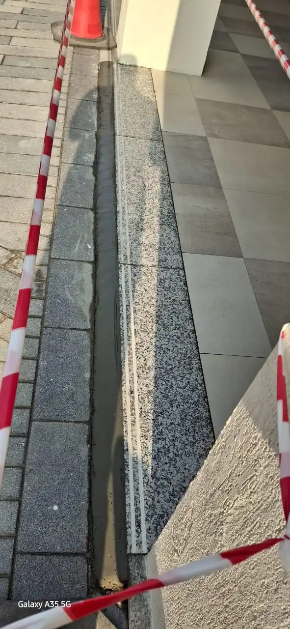 Technician installing tile pieces on a surface in Dubai — supporting project view 3