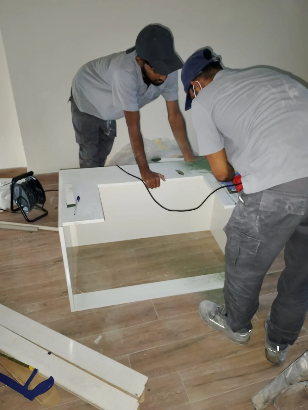 Handyman repairing a wall surface inside a Dubai home — supporting project view 1