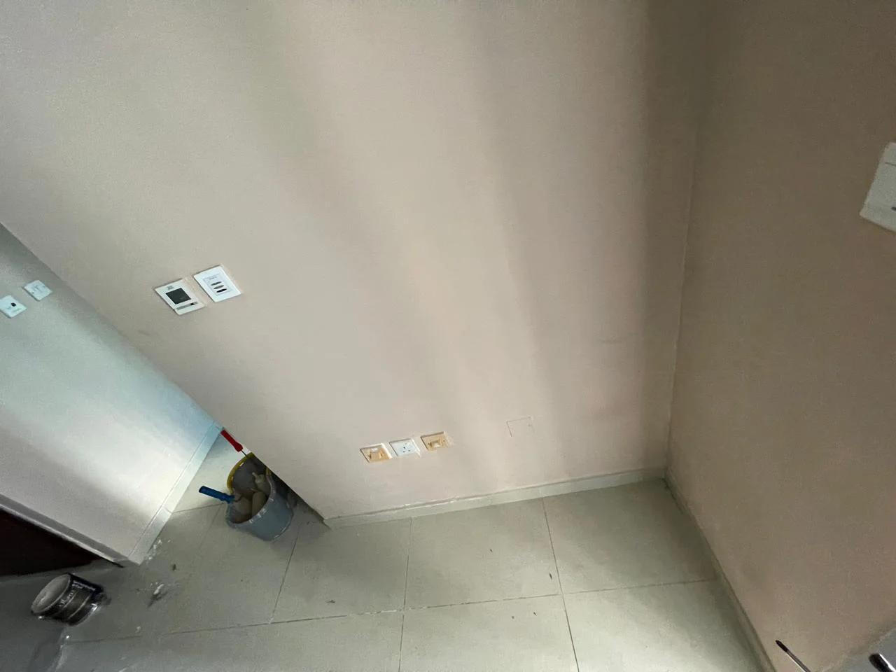 Painter applying wall paint in a Dubai apartment bedroom — supporting project view 3