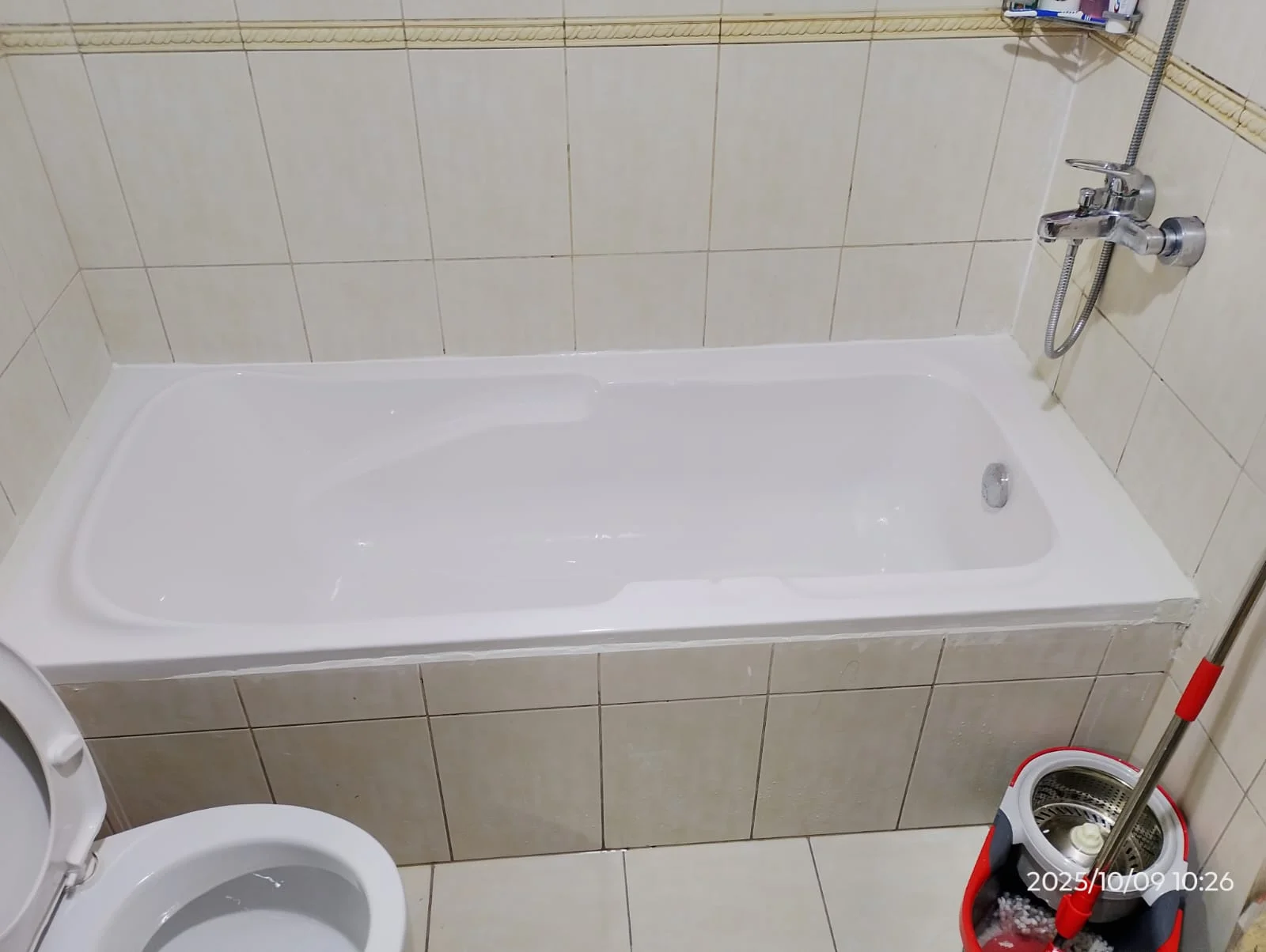 Technician carrying out bathroom plumbing work beside a toilet in Dubai — supporting project view 2