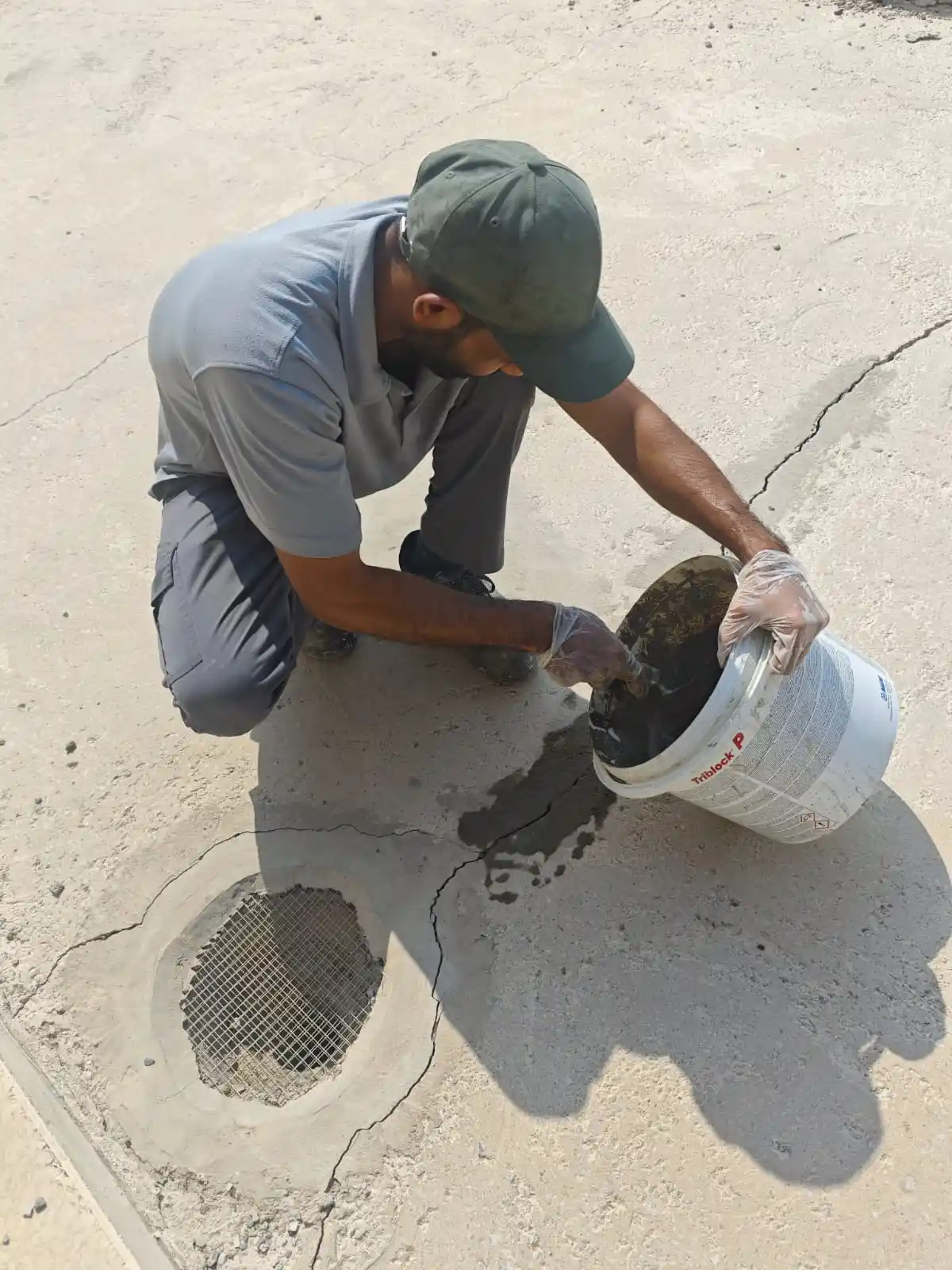 Technician applying waterproofing material along an exposed surface in Dubai — supporting project view 2