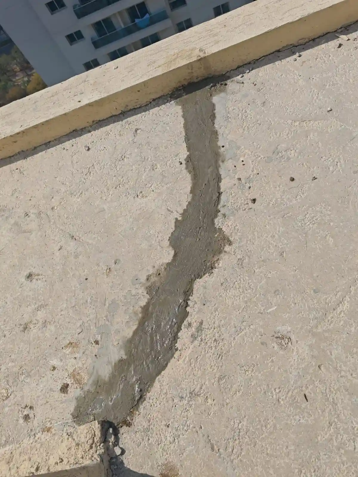 Technician repairing and waterproofing a roof surface in Dubai — supporting project view 1