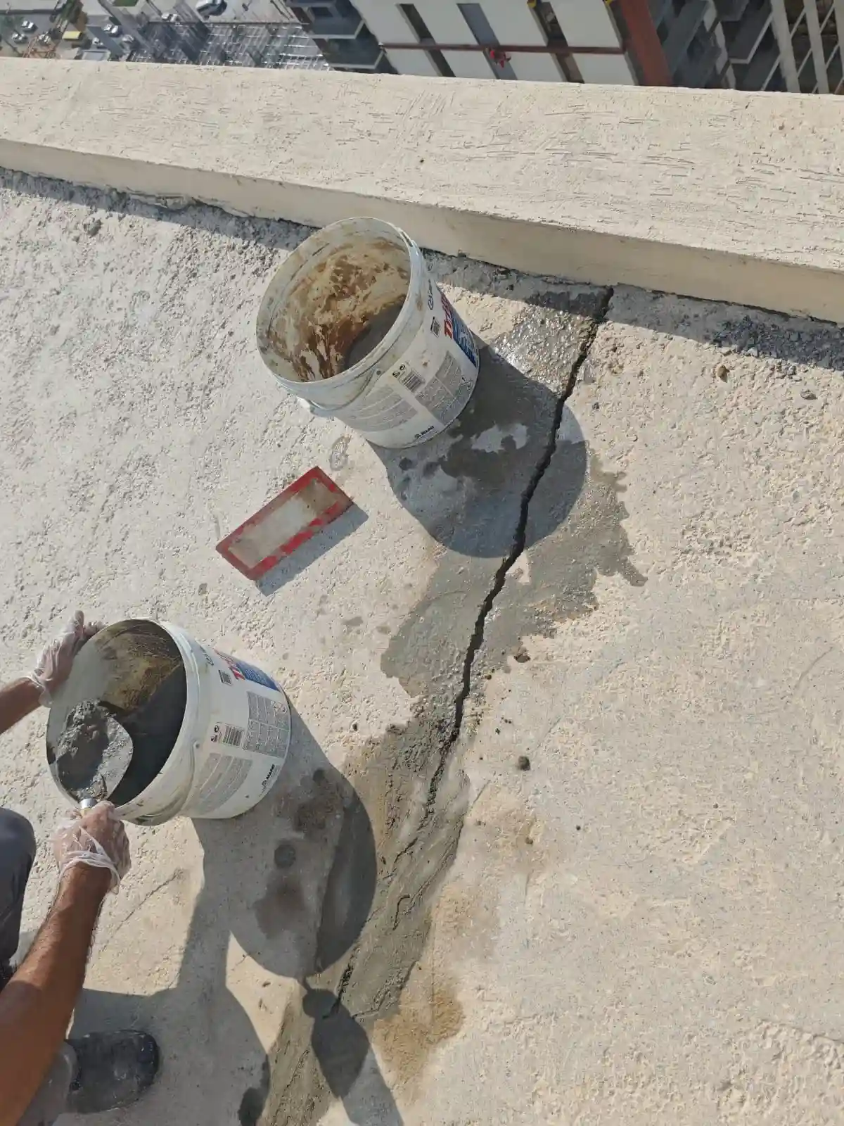 Technician repairing and waterproofing a roof surface in Dubai — supporting project view 3