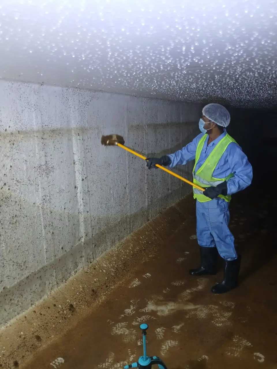 Cleaning team working inside a large water tank in Dubai — supporting project view 3