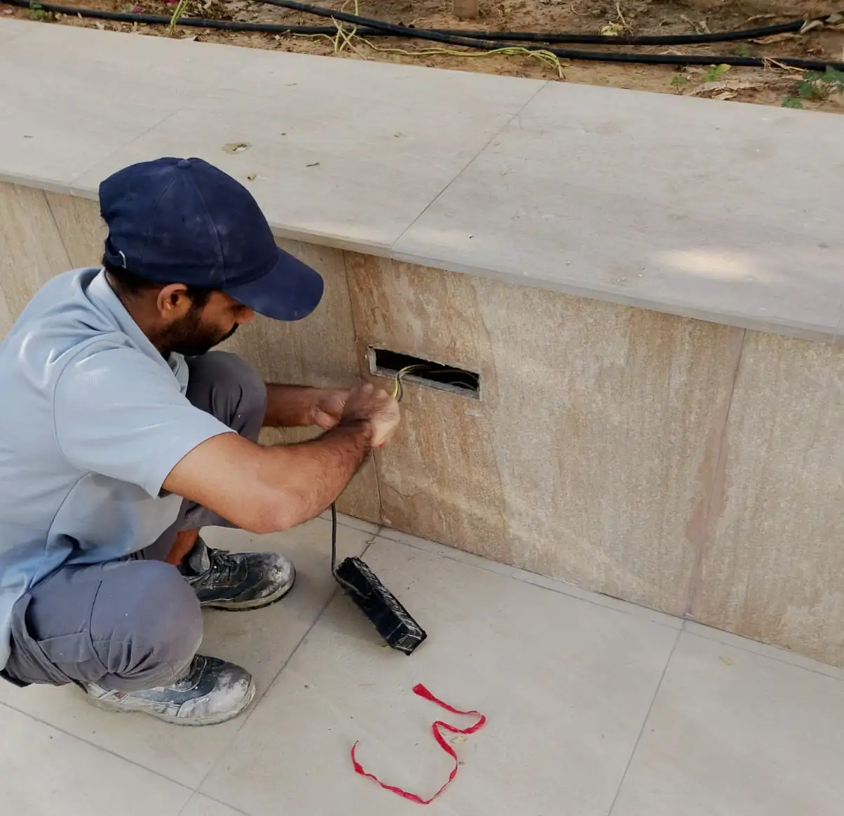 Technician carrying out a home repair in Dubai